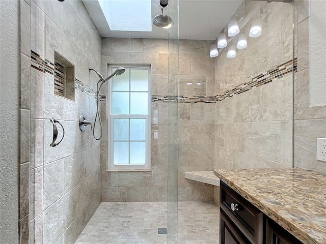 bathroom featuring a tile shower