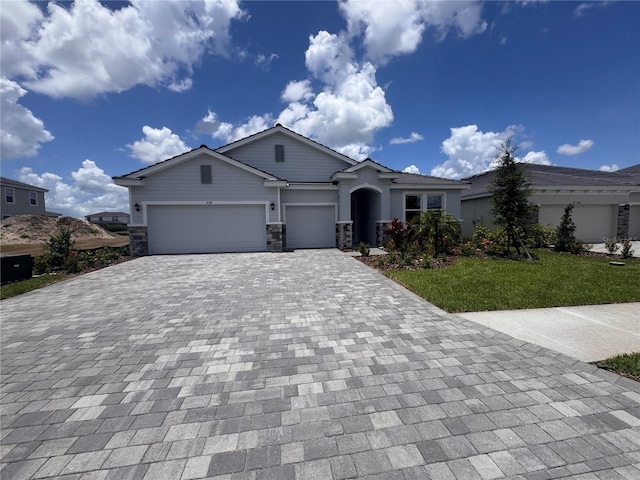 4318 Pullet Ct, Lakewood Ranch, FL 34211 - view of front of property featuring decorative driveway, an attached garage, and a front lawn