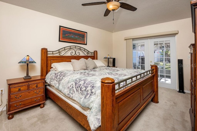 bedroom with ceiling fan, light colored carpet, french doors, and access to outside