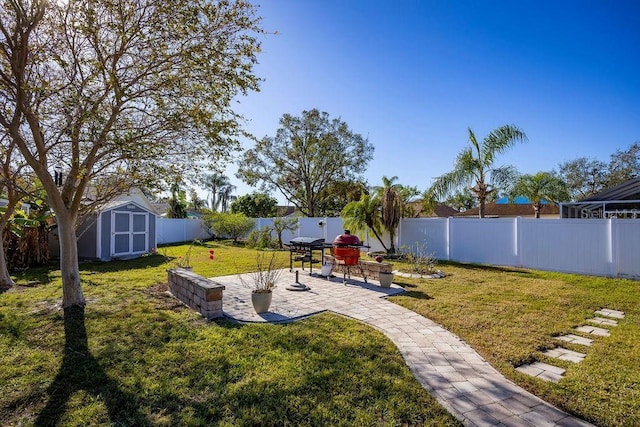 view of yard featuring a patio and a shed