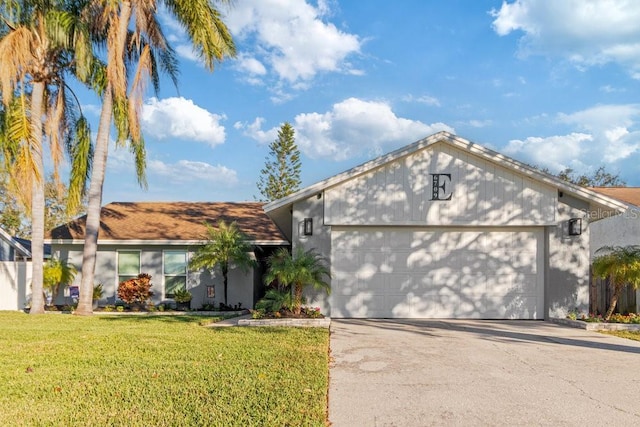 ranch-style home with a front yard and a garage