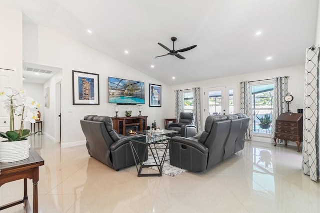 tiled living room with ceiling fan and lofted ceiling