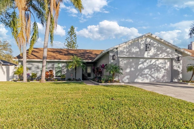 ranch-style home featuring a garage and a front lawn