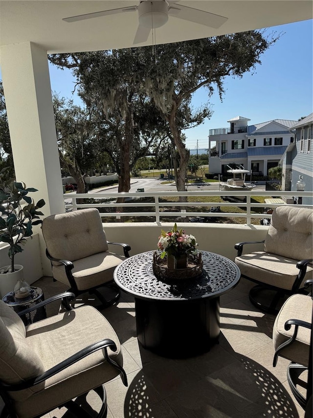 view of patio / terrace featuring a balcony and ceiling fan