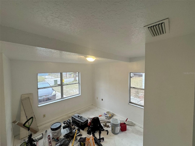 interior space featuring a textured ceiling