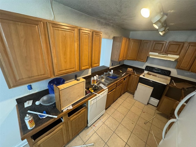 kitchen featuring dishwasher, sink, light tile patterned floors, electric stove, and a textured ceiling