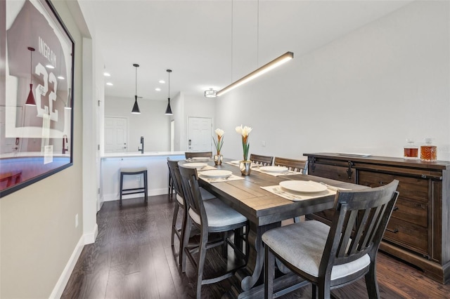 dining space with dark wood-type flooring