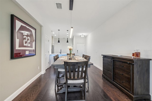 dining room featuring dark hardwood / wood-style flooring