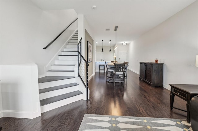 stairs with wood-type flooring