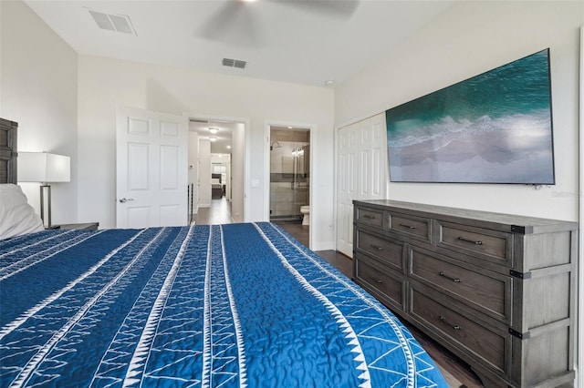 unfurnished bedroom featuring ensuite bathroom, a closet, ceiling fan, and dark hardwood / wood-style floors