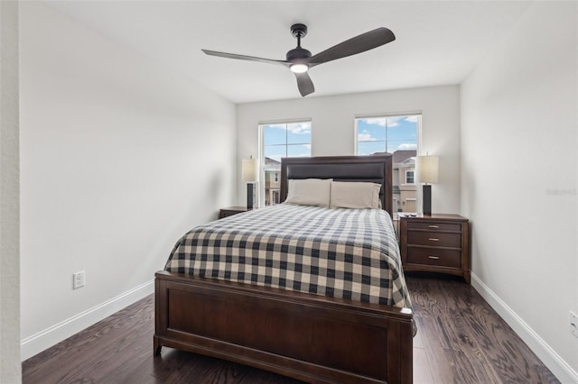 bedroom with ceiling fan and dark hardwood / wood-style floors