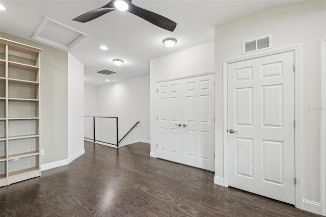 unfurnished room with dark hardwood / wood-style flooring