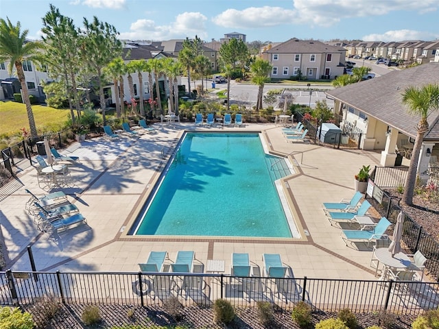 view of pool featuring area for grilling and a patio