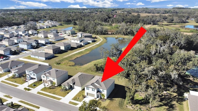 birds eye view of property featuring a water view