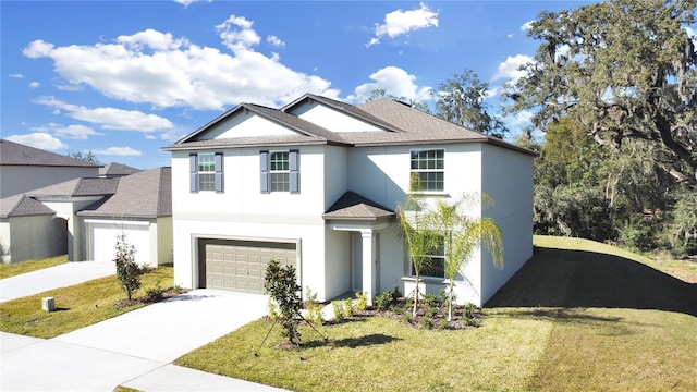 view of front of home with a front lawn and a garage