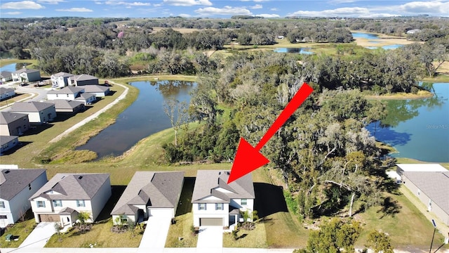 birds eye view of property featuring a water view