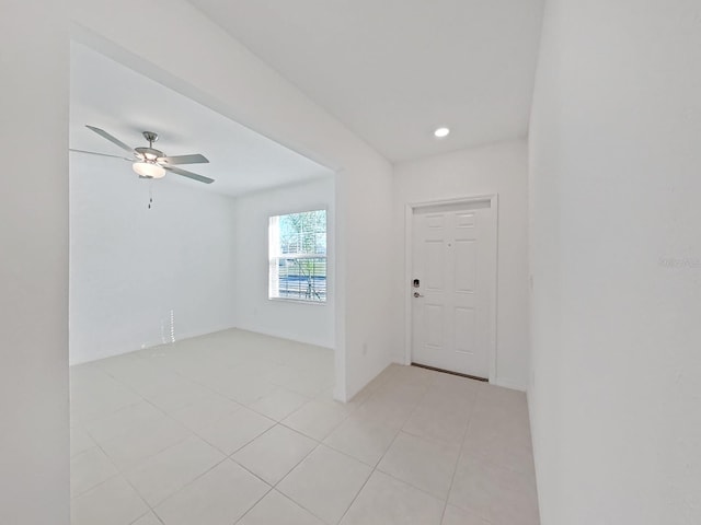 entrance foyer featuring ceiling fan and light tile patterned floors