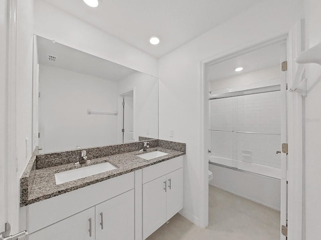 full bathroom with toilet, vanity, and combined bath / shower with glass door