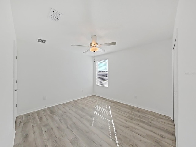 spare room with ceiling fan and light hardwood / wood-style floors