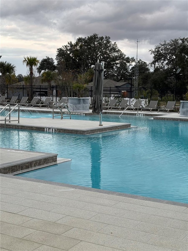 view of swimming pool featuring a patio