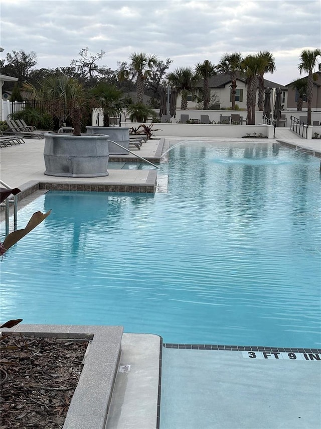 view of swimming pool with a patio area