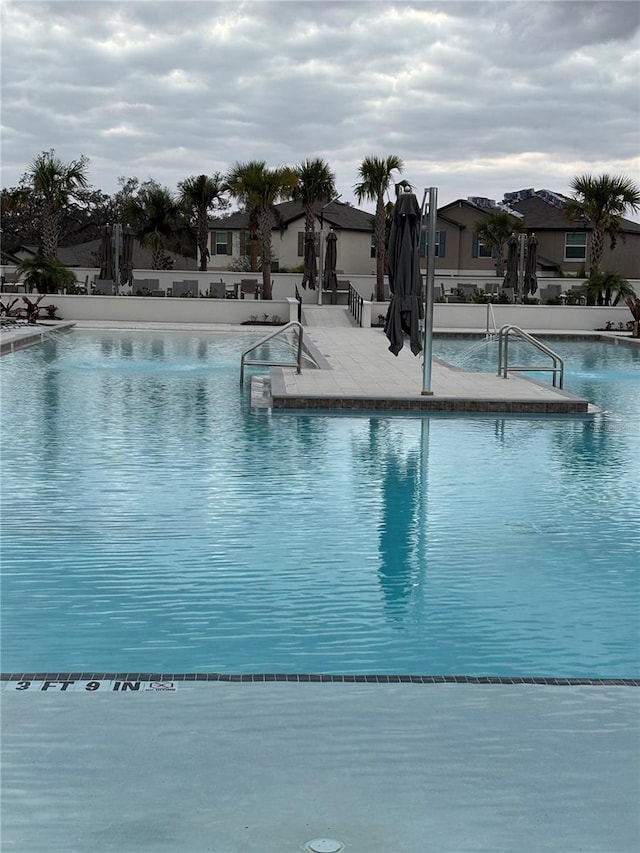 view of swimming pool featuring a patio area