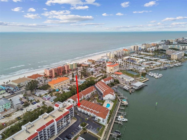 birds eye view of property featuring a water view and a view of the beach