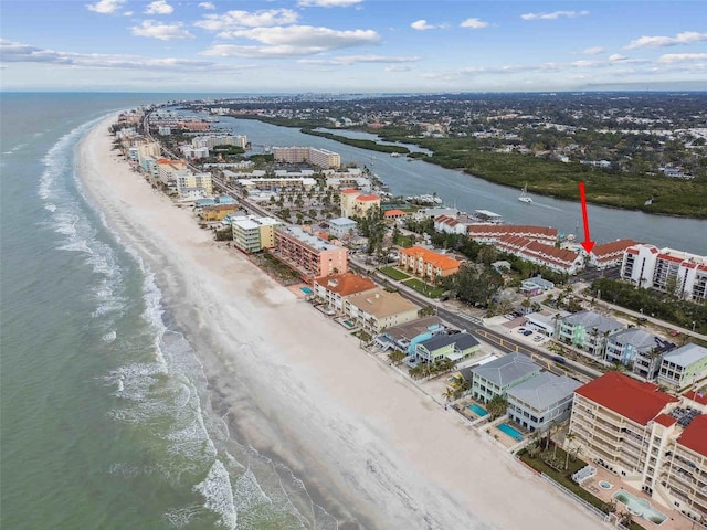 birds eye view of property featuring a view of the beach and a water view