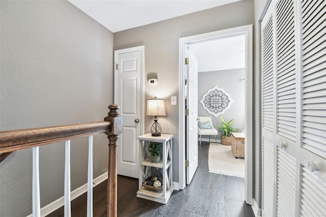 corridor featuring dark hardwood / wood-style flooring