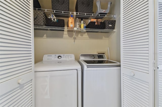 washroom featuring washer and clothes dryer