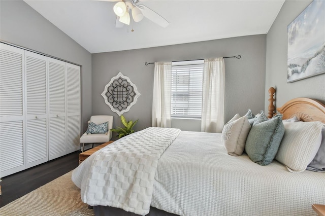 bedroom featuring a closet, vaulted ceiling, ceiling fan, and dark wood-type flooring