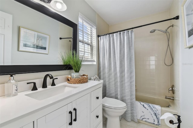 full bathroom featuring tile patterned floors, shower / tub combo with curtain, vanity, and toilet