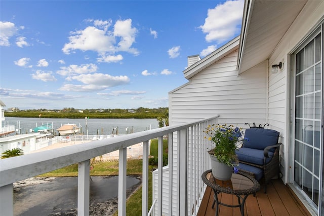 balcony featuring a water view