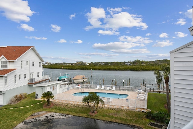 view of swimming pool with a water view, a boat dock, and a patio