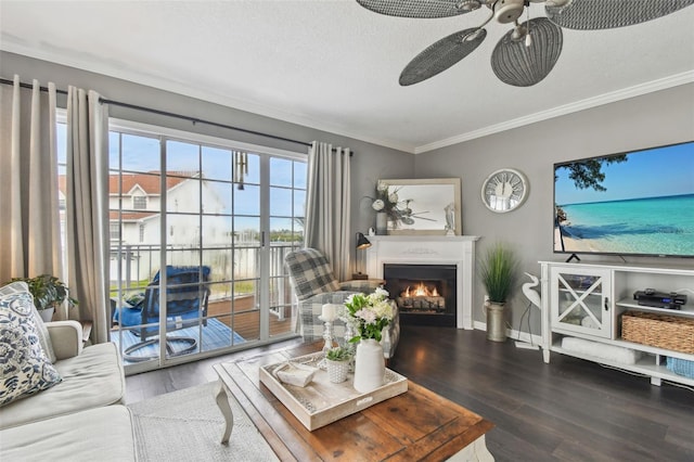 living room featuring hardwood / wood-style floors, a textured ceiling, and ornamental molding