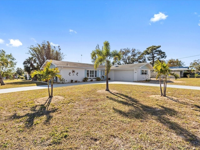 ranch-style home with a garage and a front lawn