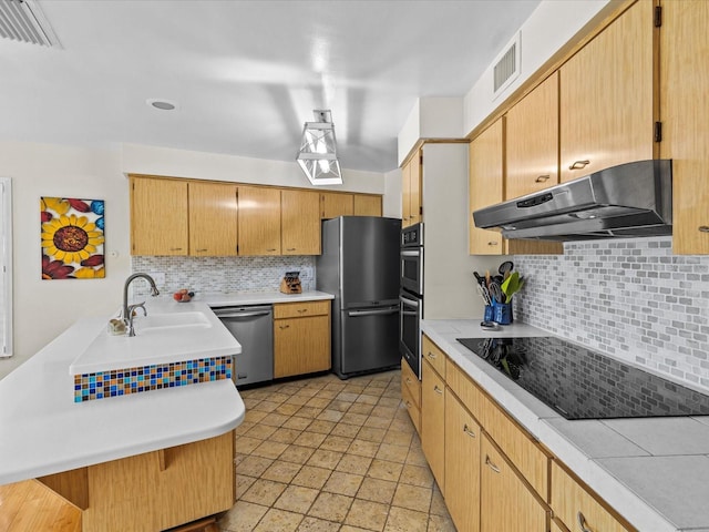 kitchen with stainless steel appliances, tasteful backsplash, a breakfast bar area, and sink