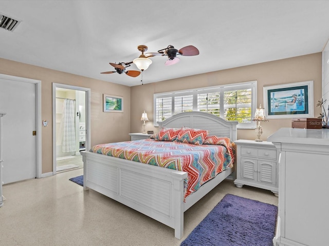 bedroom with ensuite bath and ceiling fan