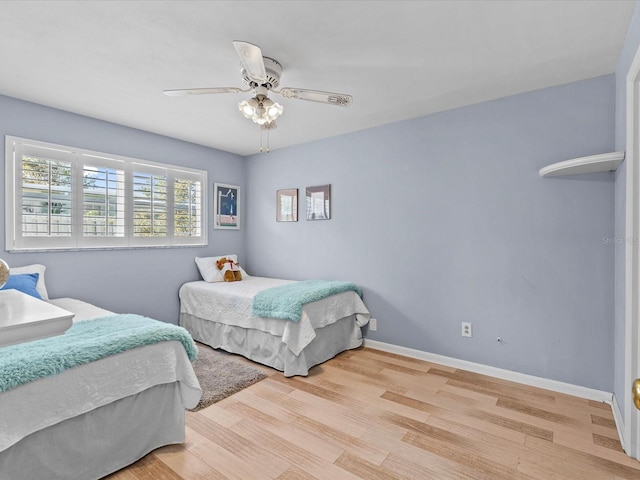 bedroom featuring light hardwood / wood-style flooring and ceiling fan