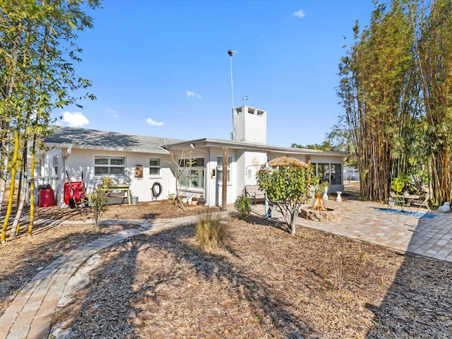 back of property featuring a patio area