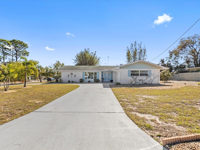 ranch-style house with a front yard