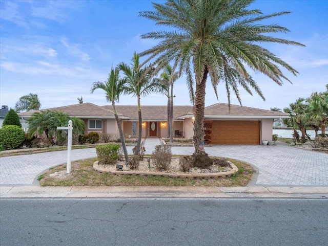 ranch-style house featuring a garage