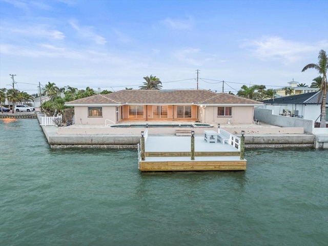 dock area featuring a patio and a water view