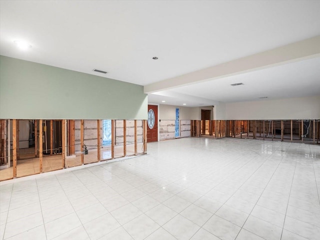 basement with light tile patterned floors