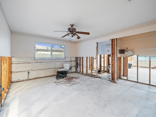 unfurnished room featuring concrete floors and ceiling fan