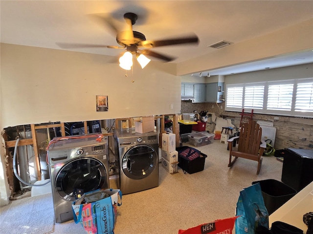 clothes washing area with ceiling fan and washer and dryer