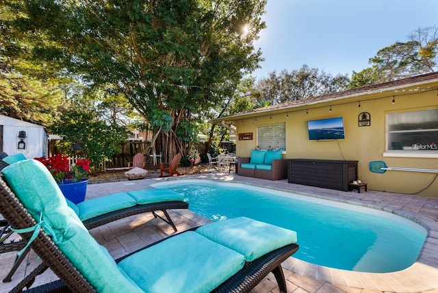 view of swimming pool featuring a patio area