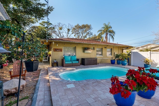 view of swimming pool with a patio area