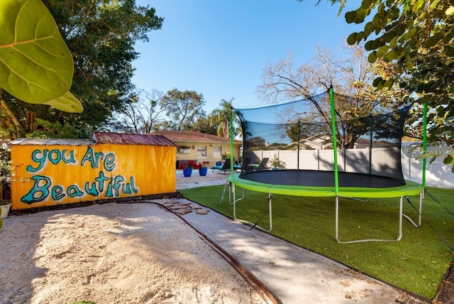 view of yard featuring a trampoline