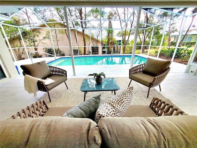 outdoor pool featuring a patio, glass enclosure, and an outdoor living space